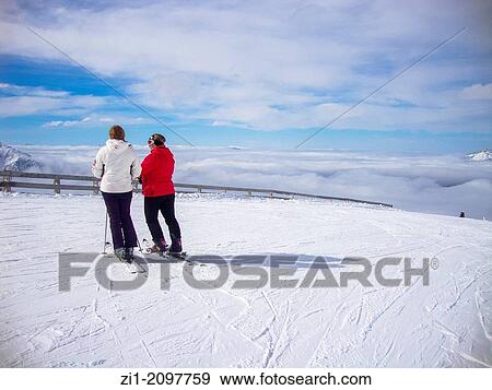 two woman with ski's at skipiste in Prapoutel, France View Large Photo Image Stock Photo - two woman with ski's at skipiste in Prapoutel, France. Fotosearch