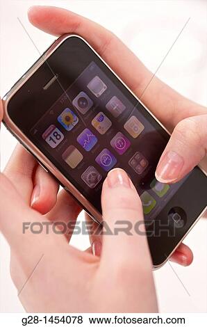 Two woman's hands selecting a task and using a phone View Large Photo Image Stock Photo - Two woman's hands selecting a task and using a phone. Fotosearch