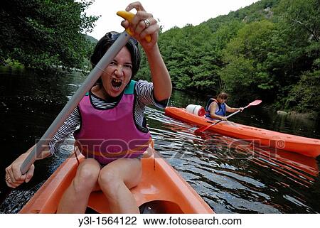 Two women canoeing on Sioule river, France View Large Photo Image Stock Image - Two women canoeing on Sioule river, France. Fotosearch