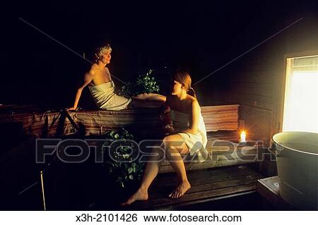 Stock Photograph - two women in smoke sauna, Finland, Northern Europe.. Fotosearch