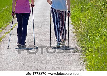 two women nordic walking, Meyrin village, close to Geneva, Switzerland View Large Photo Image Stock Image - two women nordic walking, Meyrin village, close to Geneva, Switzerland. Fotosearch