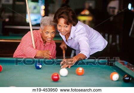 two women shooting pool View Large Photo Image Stock Image - two women shooting pool. Fotosearch
