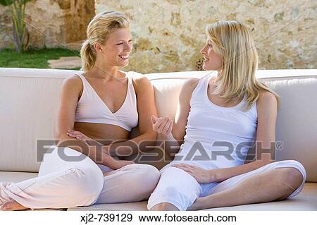 Two women talking to eachother View Large Photo Image Stock Photo - Two women talking to eachother. Fotosearch