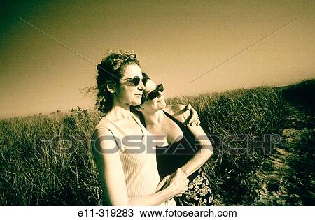 Two women walking at the beach in Long Island. NY View Large Photo Image Stock Image - Two women walking at the beach in Long Island. NY. Fotosearch