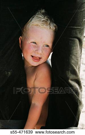 Two year and half old boy between the legs of his grandfather playing in the coast of the Finnish Gulf. Primorsk, Russia (June, 2004) View Large Photo Image Stock Photo - Two year and half old boy between the legs of his grandfather playing in the coast of the Finnish Gulf. Primorsk, Russia (June, 2004). Fotosearch