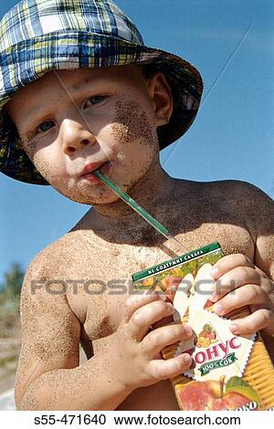 Two year and half old boy drinking apple juice in the coast of the Finnish Gulf. Primorsk, Russia (August, 2004) View Large Photo Image Stock Image - Two year and half old boy drinking apple juice in the coast of the Finnish Gulf. Primorsk, Russia (August, 2004). Fotosearch