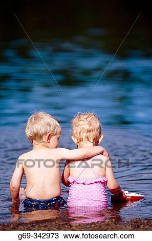 Two year old children sitting together. V? sterbotten, Sweden View Large Photo Image Stock Image - Two year old children sitting together. V? sterbotten, Sweden. Fotosearch