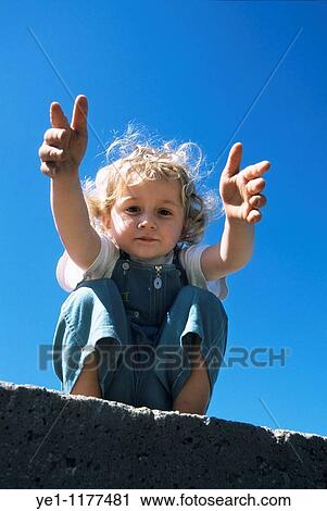 Two year old girl reaching out towards the camera, Provence, France. View Large Photo Image Stock Image - Two year old girl reaching out towards the camera, Provence, France.. Fotosearch
