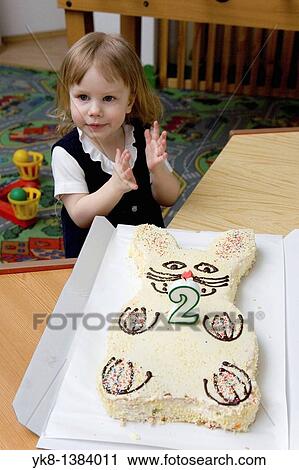 Stock Image - Two Year Old Kid Girl with Birthday Cake. Fotosearch