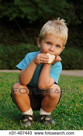 Two years old child eating. View Large Photo Image Stock Image - Two years old child eating.. Fotosearch