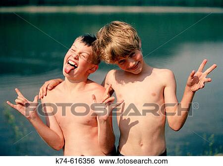 Stock Photograph - two young boys making silly faces. Fotosearch
