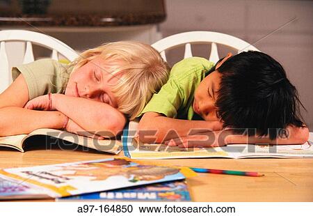 Two young children asleep View Large Photo Image Stock Image - Two young children asleep. Fotosearch