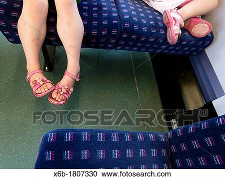 Two young children travelling by train View Large Photo Image Stock Image - Two young children travelling by train. Fotosearch