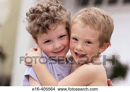 two young friends hugging View Large Photo Image Picture - two young friends hugging. Fotosearch
