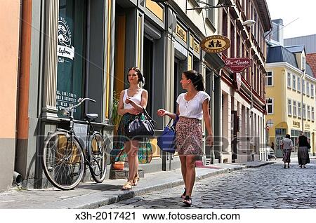 two young girls walking in a street of the Old Town of Riga, Latvia, Baltic region, Northern Europe View Large Photo Image Stock Image - two young girls walking in a street of the Old Town of Riga, Latvia, Baltic region, Northern Europe. Fotosearch