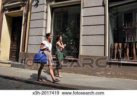 two young girls walking in a street of the Old Town of Riga, Latvia, Baltic region, Northern Europe View Large Photo Image Stock Photo - two young girls walking in a street of the Old Town of Riga, Latvia, Baltic region, Northern Europe. Fotosearch
