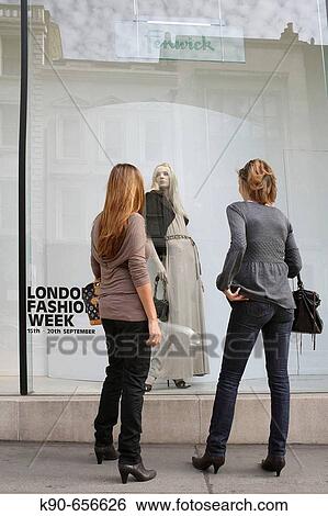 Two young ladies standing in front of a fashion boutique in Bond Street, London, United Kingdom, Europe View Large Photo Image Stock Photograph - Two young ladies standing in front of a fashion boutique in Bond Street, London, United Kingdom, Europe. Fotosearch