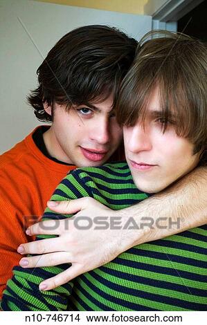 Two young men clowning around. View Large Photo Image Picture - Two young men clowning around.. Fotosearch