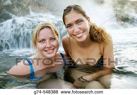 Two young Russian women enjoying hot springs in Yellowstone National Park, Wyoming. USA. View Large Photo Image Stock Photo - Two young Russian women enjoying hot springs in Yellowstone National Park, Wyoming. USA.. Fotosearch
