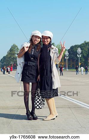 Two young stylish women posing in front of the Ho Chi Minh Mausoleum in Hanoi, Vietnam View Large Photo Image Stock Photo - Two young stylish women posing in front of the Ho Chi Minh Mausoleum in Hanoi, Vietnam. Fotosearch