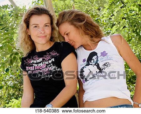 two young woman in casual clothing View Large Photo Image Stock Photography - two young woman in casual clothing. Fotosearch