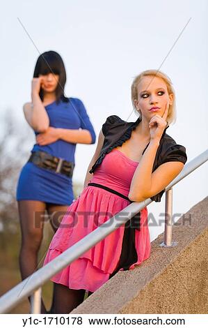 Stock Photo - Two young women are contemplating. Fotosearch