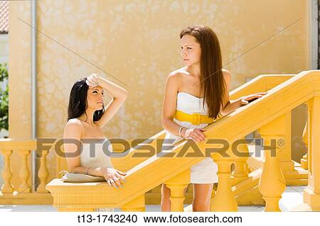 Two young women in Europe and it's hot View Large Photo Image Stock Image - Two young women in Europe and it's hot. Fotosearch