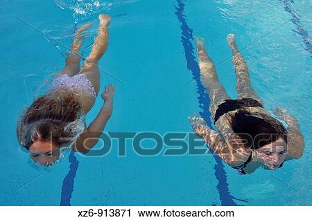 two young women in the swimming pool View Large Photo Image Stock Image - two young women in the swimming pool. Fotosearch