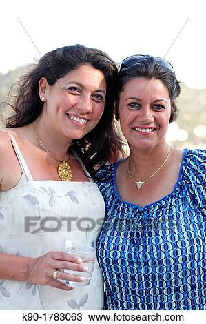 Two young women, Mallorca, Spain View Large Photo Image Stock Image - Two young women, Mallorca, Spain. Fotosearch