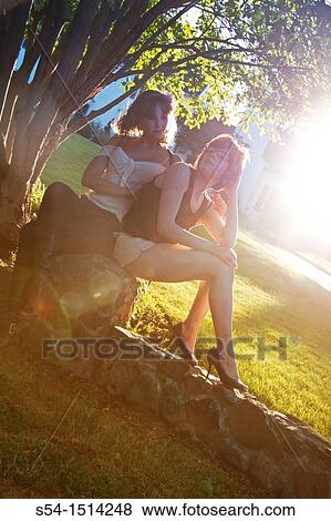 Stock Photo - Two young women outdoors in Spokane, Washington, USA.. Fotosearch