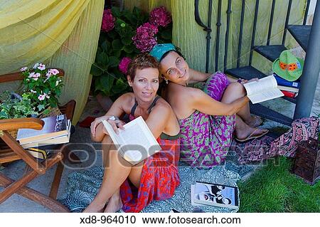 two young women reading View Large Photo Image Stock Image - two young women reading. Fotosearch