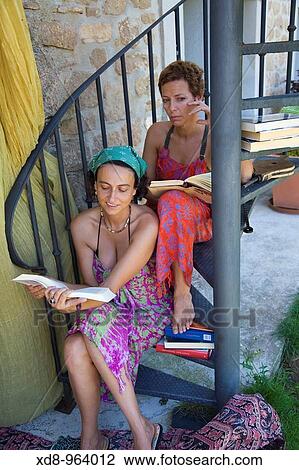 two young women reading View Large Photo Image Stock Image - two young women reading. Fotosearch