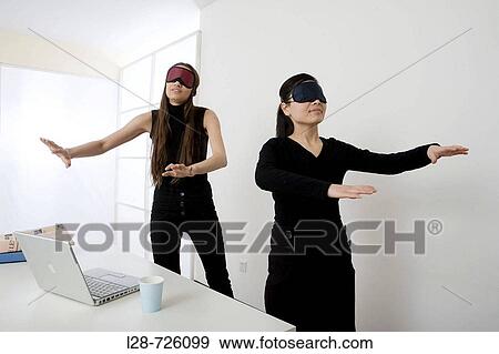 two young women searching View Large Photo Image Stock Photo - two young women searching. Fotosearch