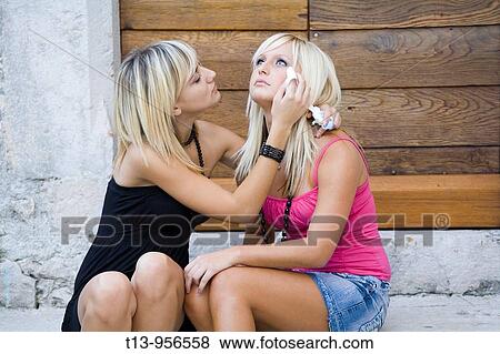 Two young women together, one is crying View Large Photo Image Stock Photo - Two young women together, one is crying. Fotosearch