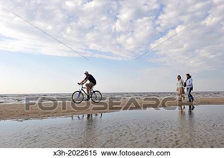 two young women walking on the beach, Jurmala, Gulf of Riga, Latvia, Baltic region, Northern Europe. View Large Photo Image Stock Photography - two young women walking on the beach, Jurmala, Gulf of Riga, Latvia, Baltic region, Northern Europe.. Fotosearch