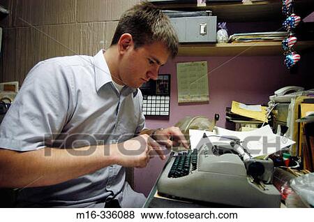 Typer in a small office View Large Photo Image Stock Photo - Typer in a small office. Fotosearch