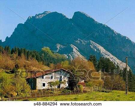 Typical Basque house and Untzillaitz mountain (936 mts. ) Urkiola natural park. Biscay. Basque Country. Spain. View Large Photo Image Picture - Typical Basque house and Untzillaitz mountain (936 mts. ) Urkiola natural park. Biscay. Basque Country. Spain.. Fotosearch