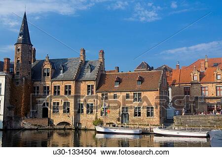 Typical canal and houses in the medieval town of Brugge, listed World Heritage Site by UNESCO Flanders Belgium View Large Photo Image Picture - Typical canal and houses in the medieval town of Brugge, listed World Heritage Site by UNESCO Flanders Belgium. Fotosearch