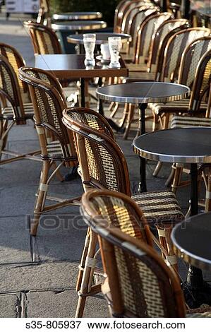 Typical chairs and tables of a sidewalk cafe of Paris. France View Large Photo Image Stock Photo - Typical chairs and tables of a sidewalk cafe of Paris. France. Fotosearch