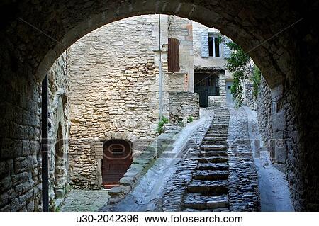 Typical paved street in Gordes village, labeled The Most Beautiful Villages of France, Vaucluse department, Provence-Alpes-Cote d'Azur region. France. View Large Photo Image Stock Photograph - Typical paved street in Gordes village, labeled The Most Beautiful Villages of France, Vaucluse department, Provence-Alpes-Cote d'Azur region. France.. Fotosearch
