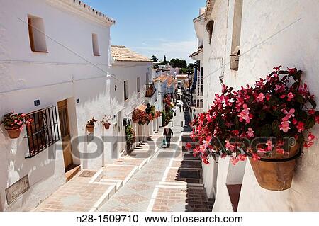 Typical street in the white village of Mijas, Malaga Province, Costa del Sol, Andalusia, Spain. View Large Photo Image Stock Image - Typical street in the white village of Mijas, Malaga Province, Costa del Sol, Andalusia, Spain.. Fotosearch