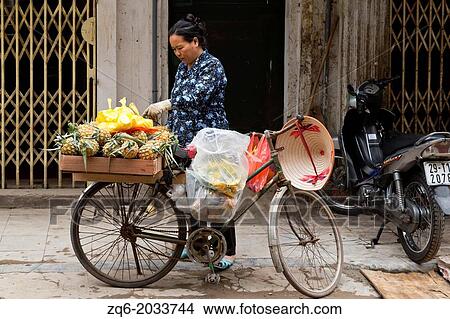 Picture - Typical Street Seller in Hanoi, Vietnam.. Fotosearch