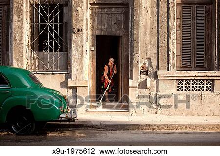 Stock Image - typical street with classic US car in Centro Habana, Havana, Cuba, Caribbean.. Fotosearch
