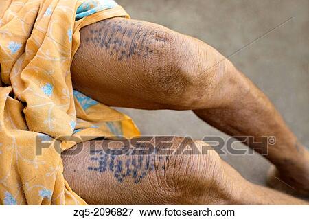 Stock Photo - Typical tattoos on woman's legs, Gond tribe, Gadchiroli, Maharashtra, India.. Fotosearch