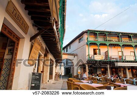 Stock Photograph - Typical tavern and terraces at the Main Square at dusk. Chinchon, Madrid province, Spain.. Fotosearch
