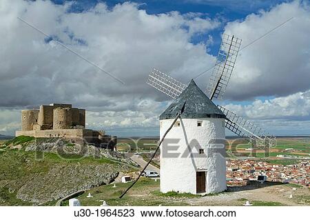 Typical windmill and castle in Consuegra village, in the Route of Don Qiuijote, Toledo province, Castilla-La Mancha, Spain. View Large Photo Image Stock Image - Typical windmill and castle in Consuegra village, in the Route of Don Qiuijote, Toledo province, Castilla-La Mancha, Spain.. Fotosearch