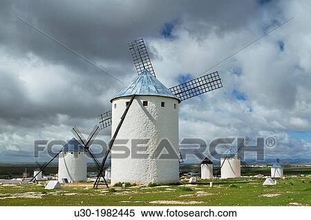 Stock Photography - Typical windmills in Campo de Criptana village, in the Route of Don Qiuijote, Ciudad Real province, Castilla-La Mancha, Spain.. Fotosearch