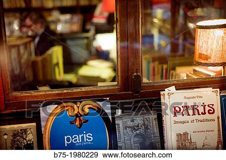 Stock Photo - Typical window of a bookstore in Paris, France, Europe. Fotosearch
