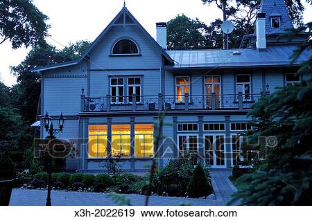 Stock Photo - typical wooden house of Jurmala at dusk, Gulf of Riga, Latvia, Baltic region, Northern Europe.. Fotosearch