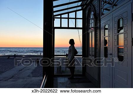 Stock Image - typical wooden house on seaside at dusk, Jurmala, Gulf of Riga, Latvia, Baltic region, Northern Europe.. Fotosearch